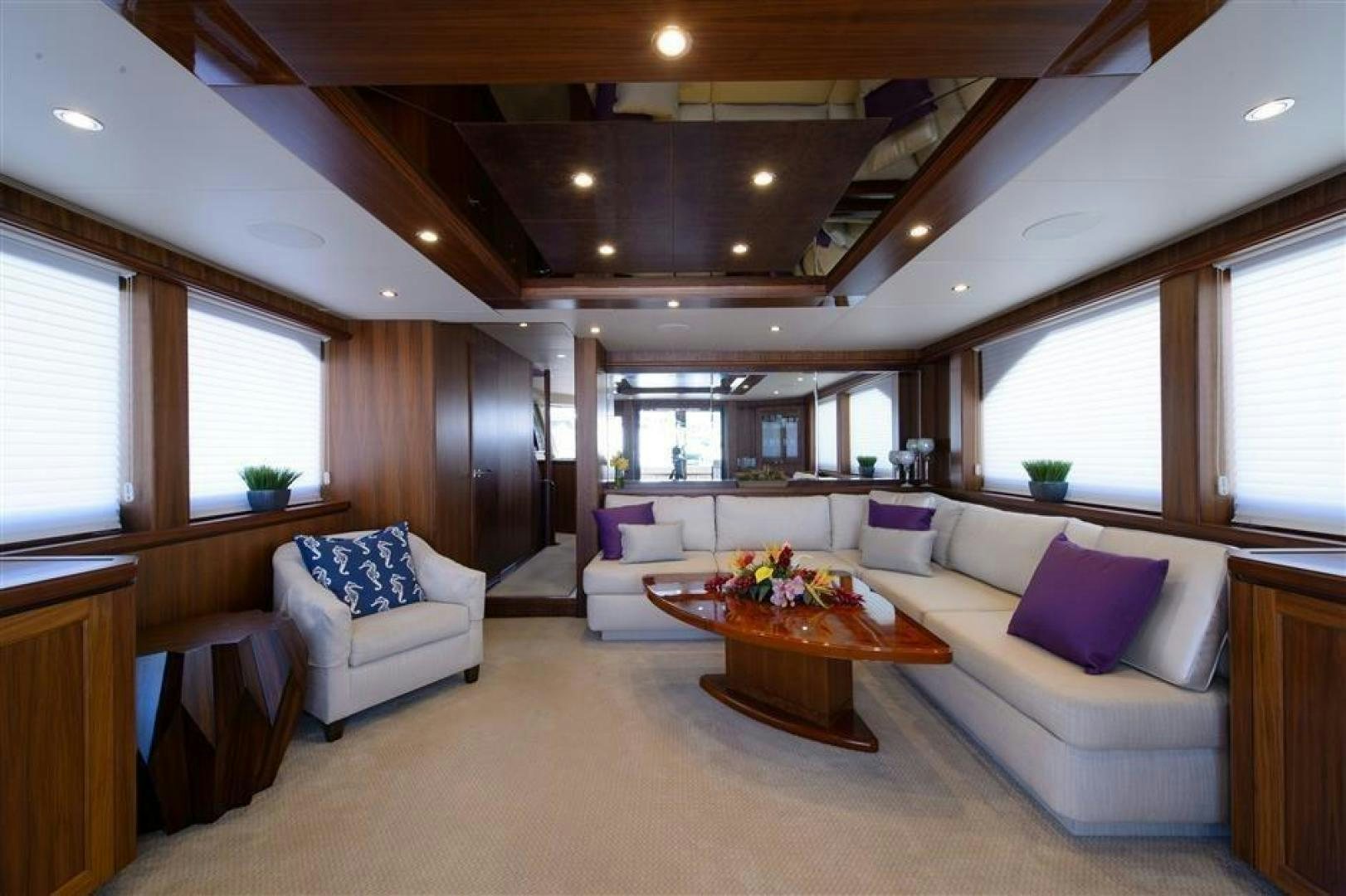 a living room with a couch and a table aboard OCEANA Yacht for Sale