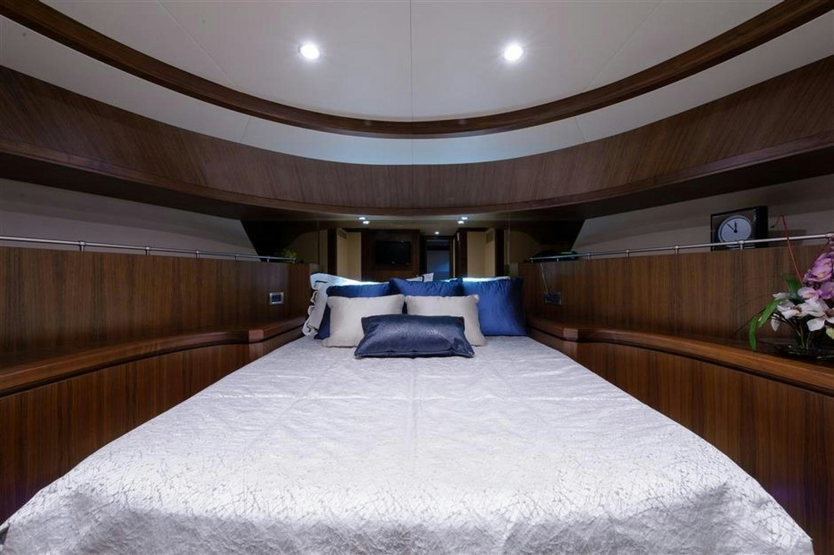 a bed with a white sheet and pillows aboard OCEANA Yacht for Sale