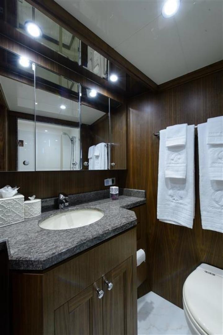 a bathroom with a sink and a mirror aboard OCEANA Yacht for Sale