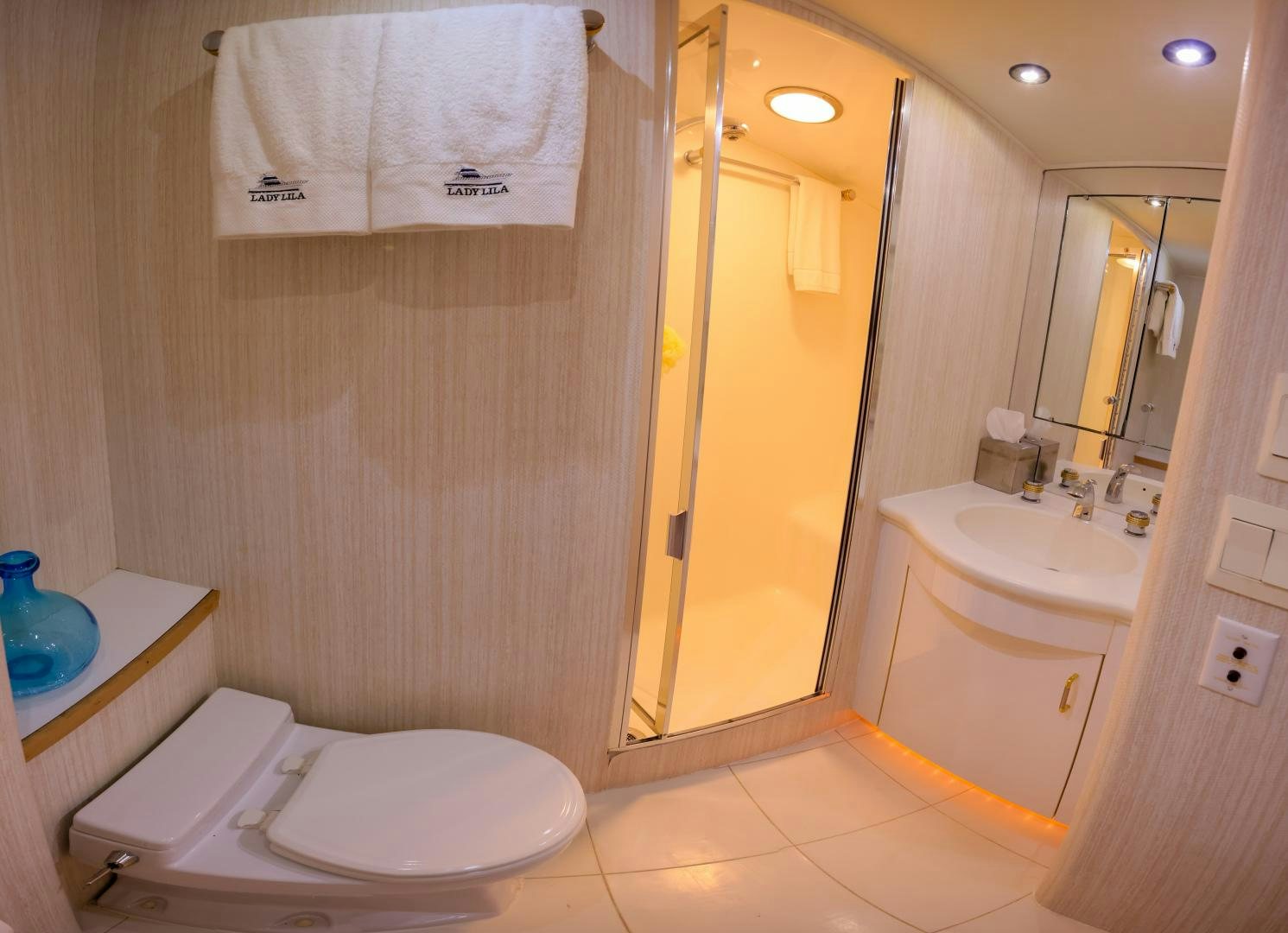 a bathroom with a toilet sink and a mirror aboard LADY LILA Yacht for Sale