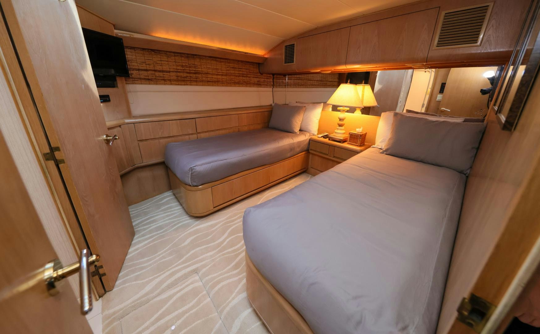 a bed in a room aboard LADY LILA Yacht for Sale