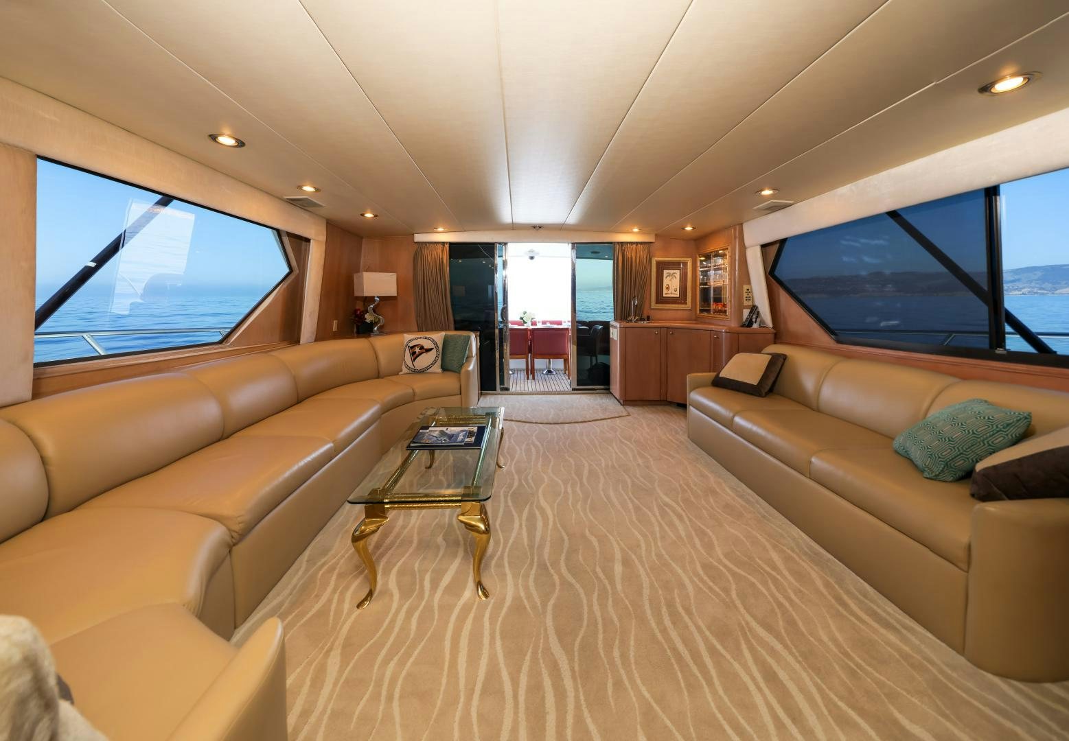 a living room with a couch and a table aboard LADY LILA Yacht for Sale