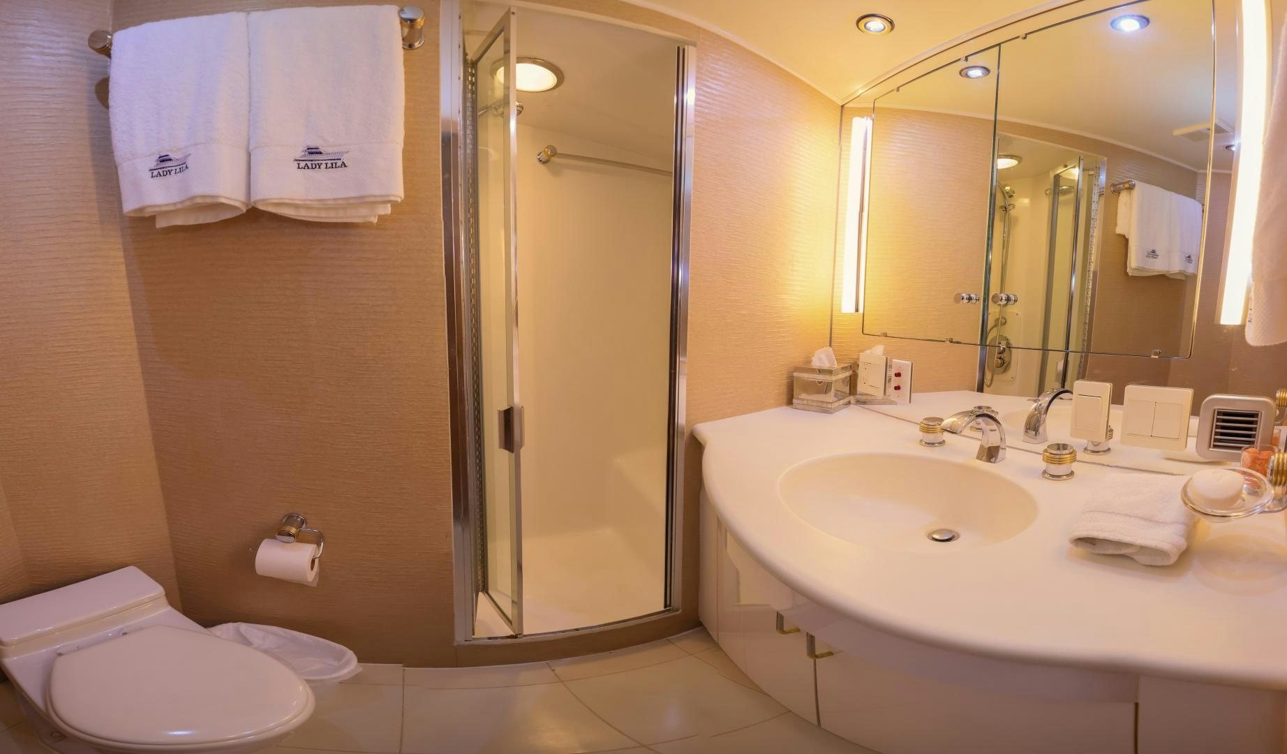 a bathroom with a shower sink and toilet aboard LADY LILA Yacht for Sale