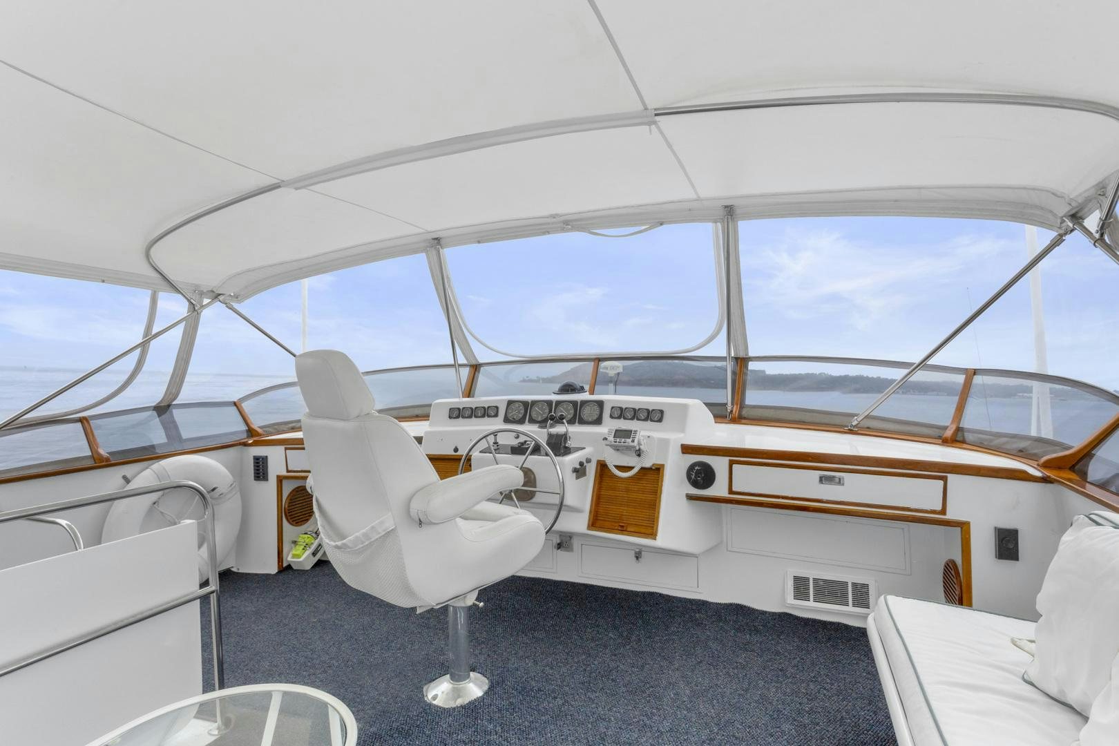 a white chair in a room aboard ELEGANTE Yacht for Sale