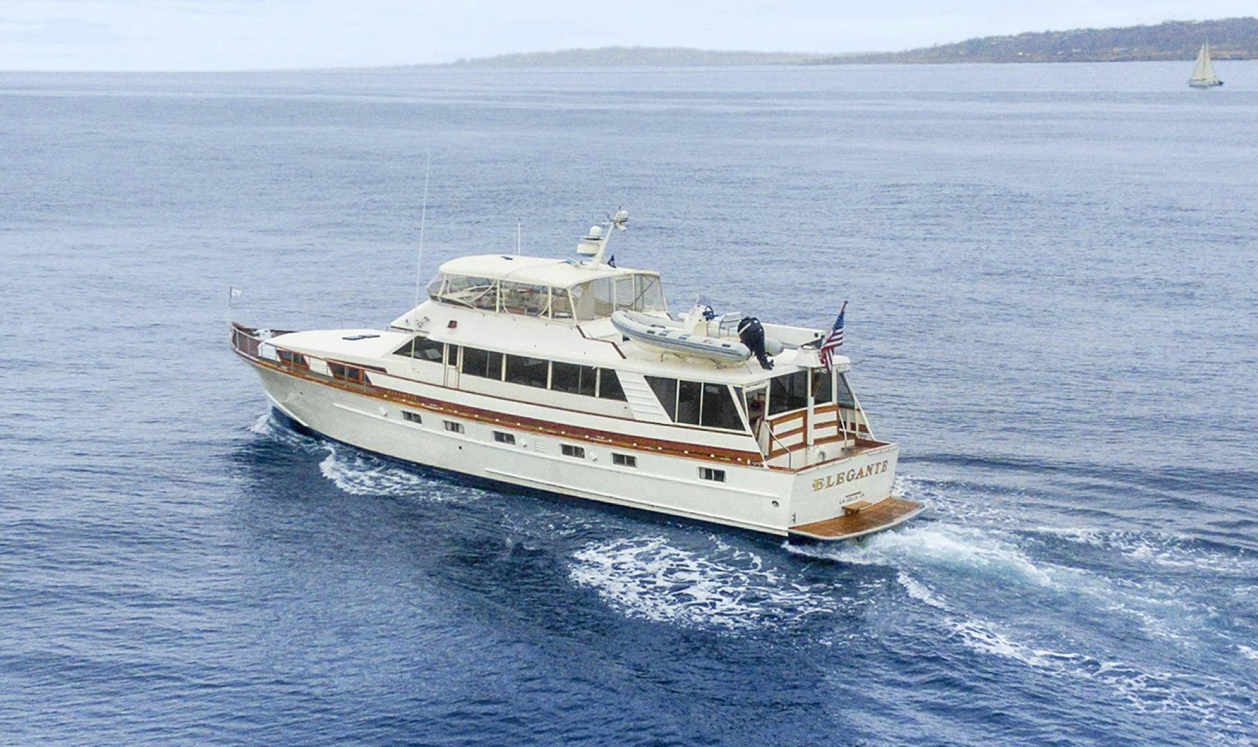 a large white boat in the water aboard ELEGANTE Yacht for Sale