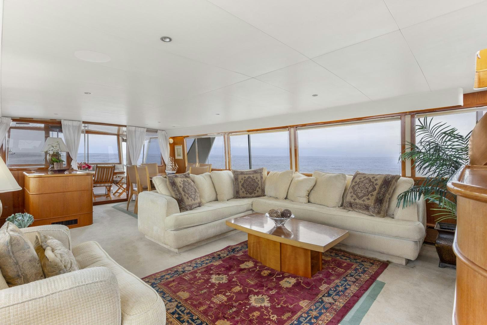 a living room with a large window aboard ELEGANTE Yacht for Sale