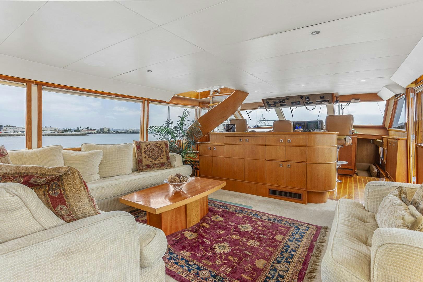 a living room with a large window aboard ELEGANTE Yacht for Sale