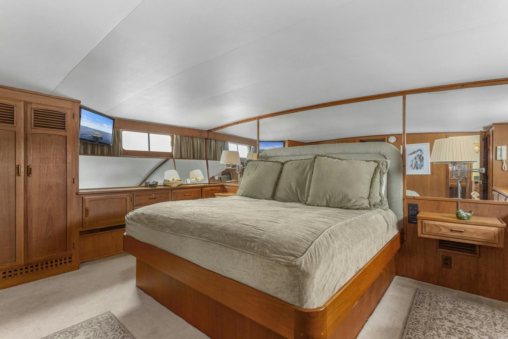 a bed in a room aboard ELEGANTE Yacht for Sale