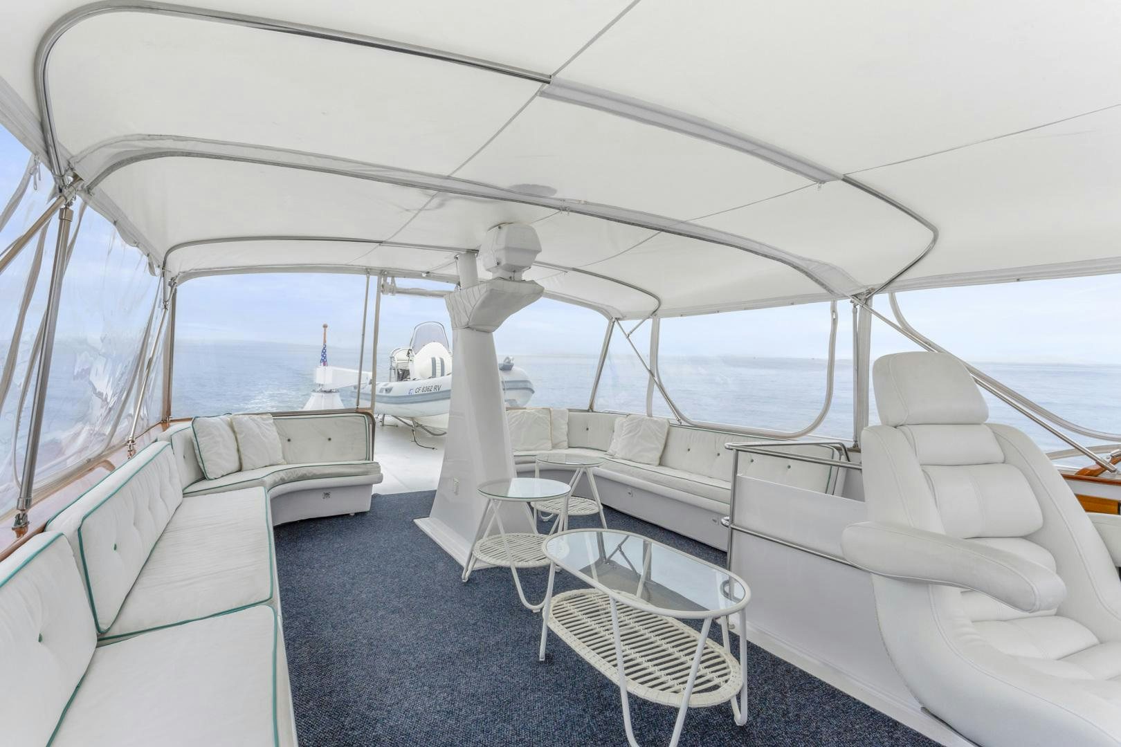 a boat with chairs and tables aboard ELEGANTE Yacht for Sale