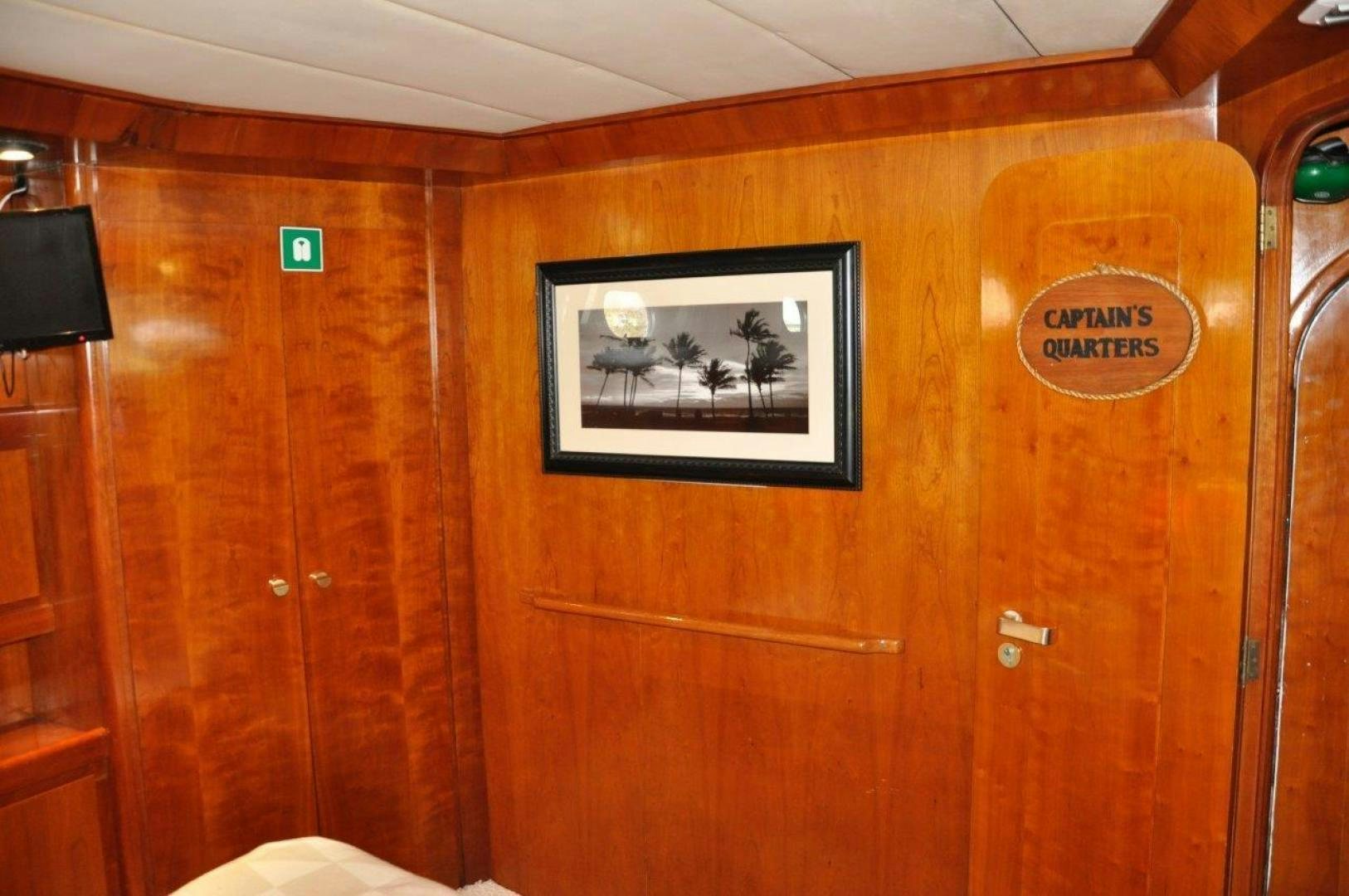 a wood cabinet with a picture on it aboard M.I.S. MOONDANCE Yacht for Sale