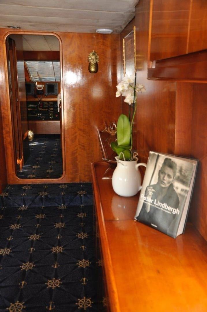 a vase with flowers on a table aboard M.I.S. MOONDANCE Yacht for Sale
