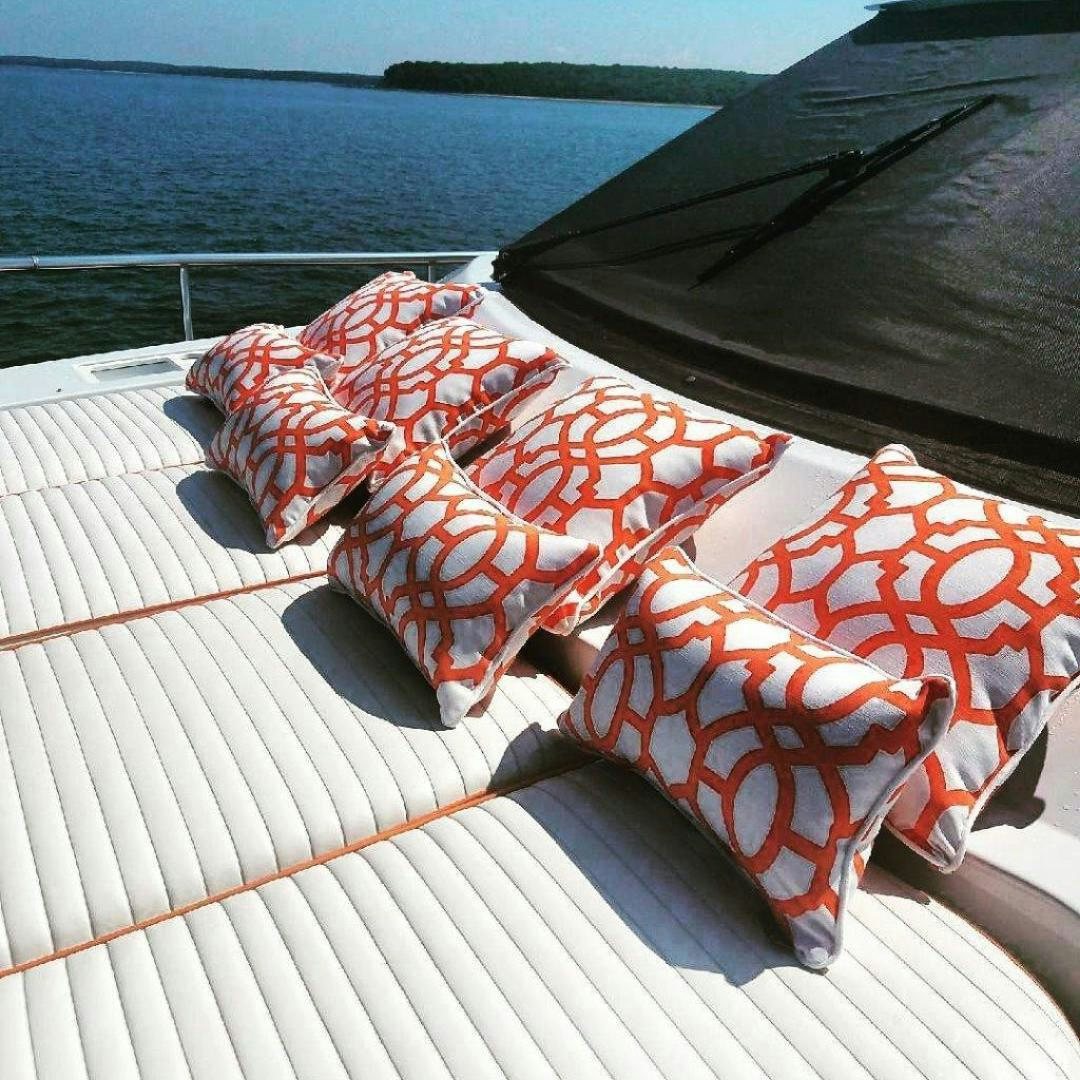 a red and white umbrella on a deck aboard M.I.S. MOONDANCE Yacht for Sale