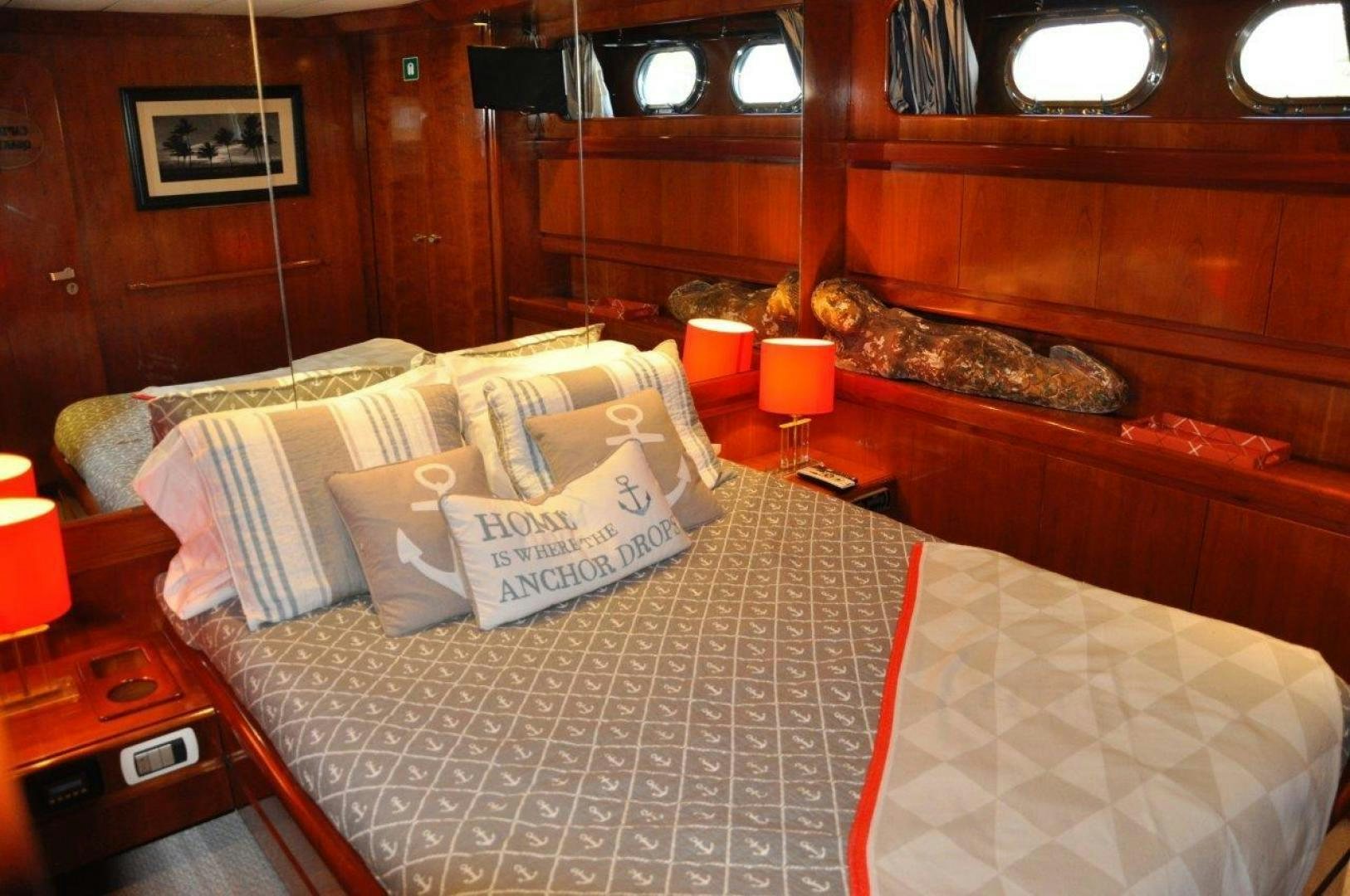 a bed with pillows aboard M.I.S. MOONDANCE Yacht for Sale