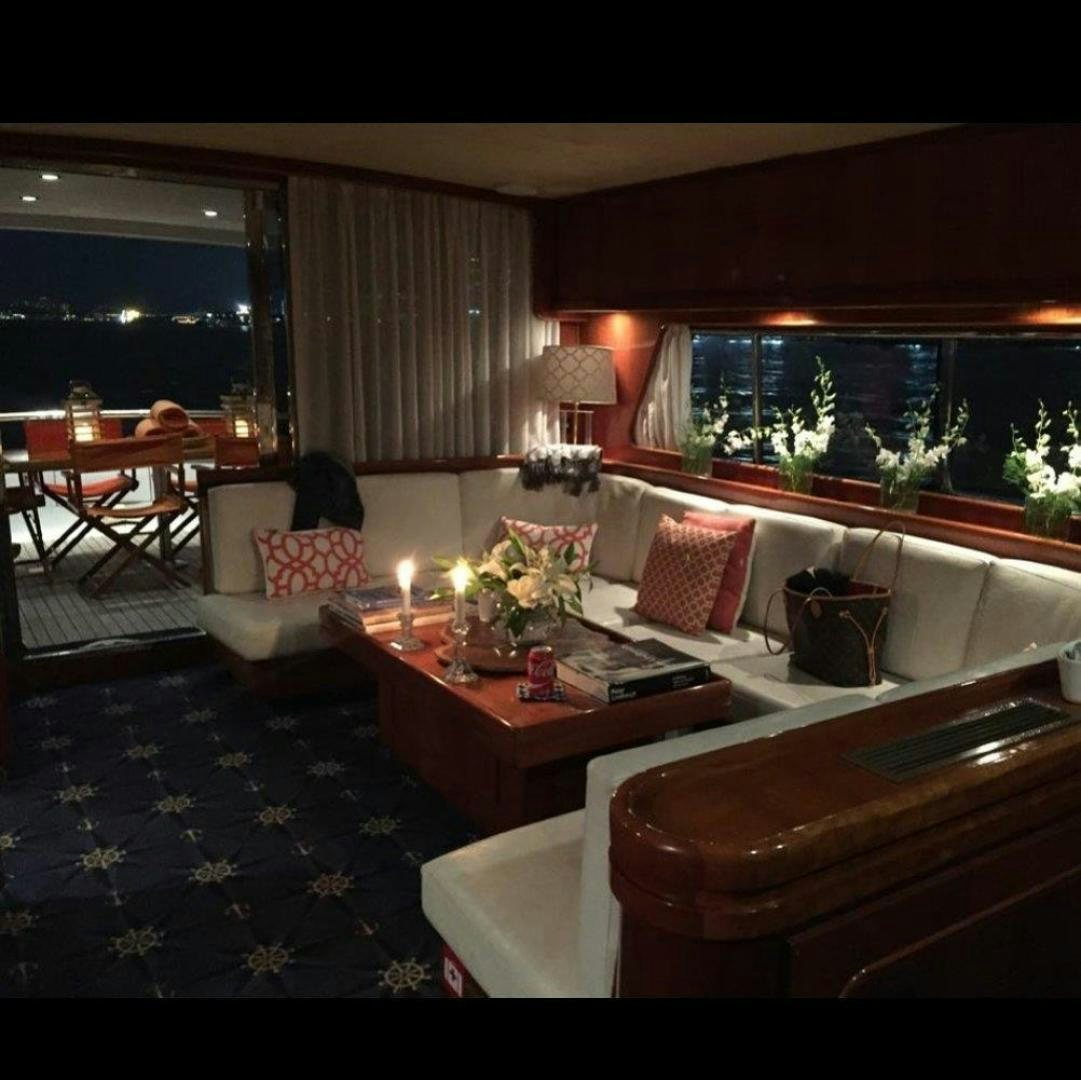 a living room with a couch and a table aboard M.I.S. MOONDANCE Yacht for Sale