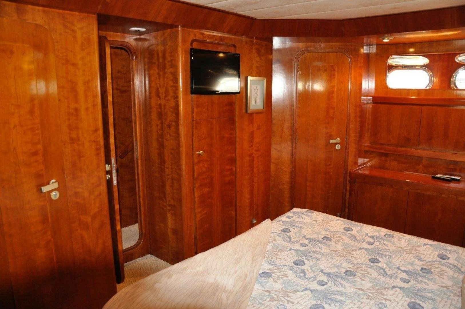 a bed in a room aboard M.I.S. MOONDANCE Yacht for Sale