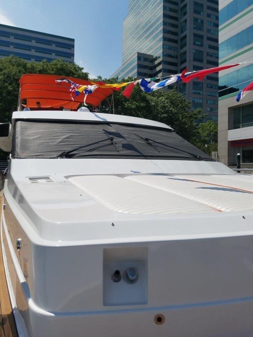a white car with a red and white stripe parked on the side aboard M.I.S. MOONDANCE Yacht for Sale