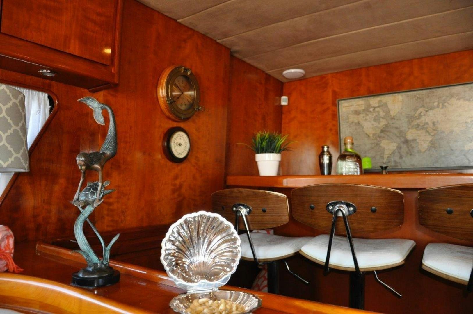 a kitchen with a table and chairs aboard M.I.S. MOONDANCE Yacht for Sale