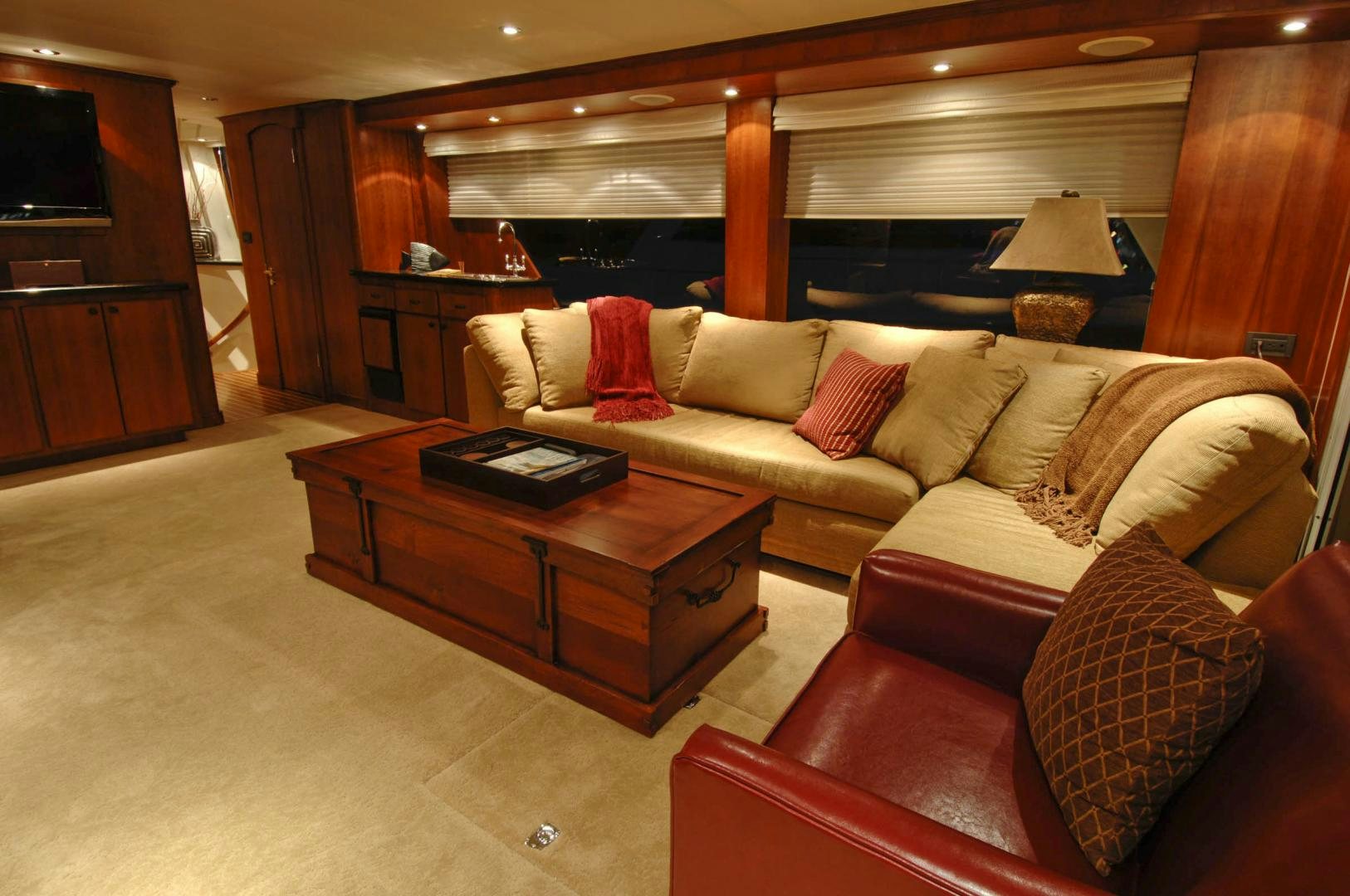 a living room with a couch and a coffee table aboard LADY O Yacht for Sale
