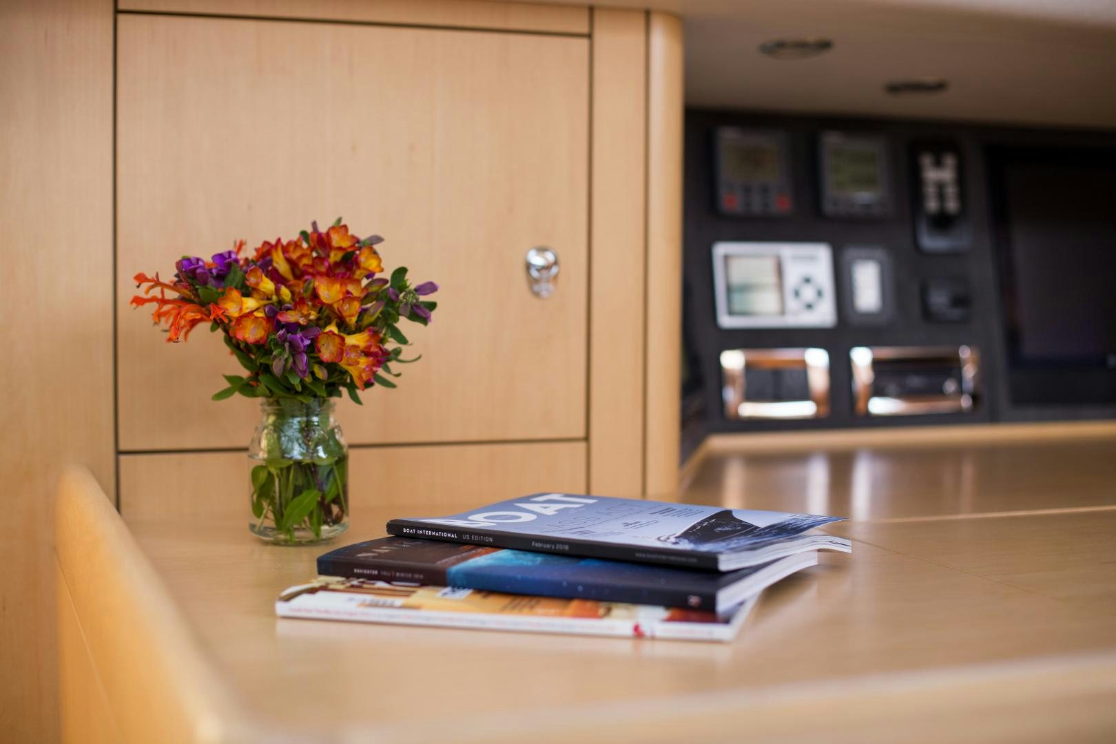 a vase of flowers on a table aboard MATHILDA SOUND Yacht for Sale