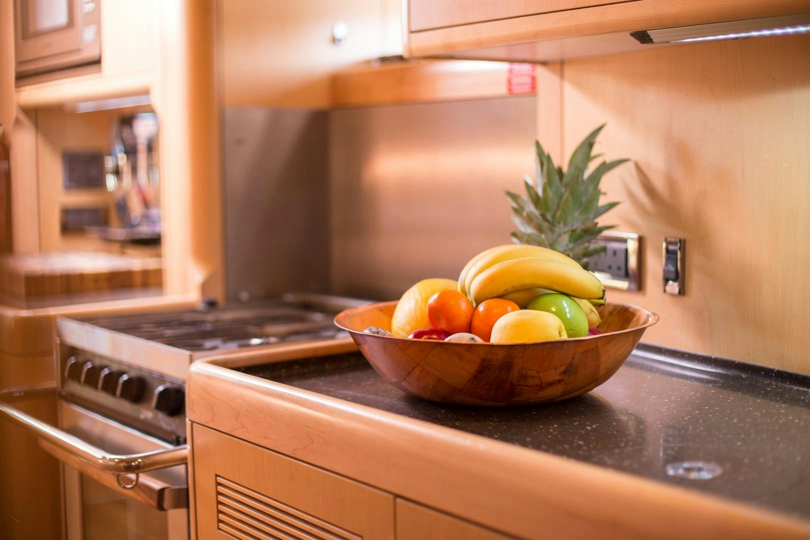 a bowl of fruit on a kitchen counter aboard MATHILDA SOUND Yacht for Sale