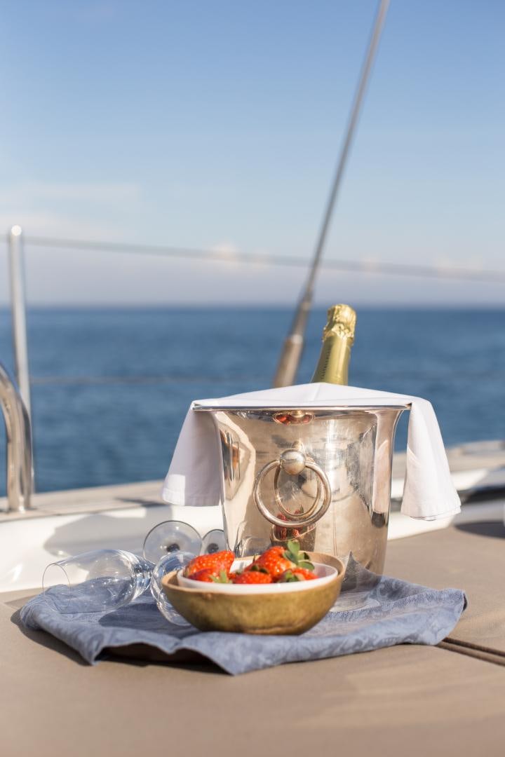 a bowl of fruit on a table aboard MATHILDA SOUND Yacht for Sale