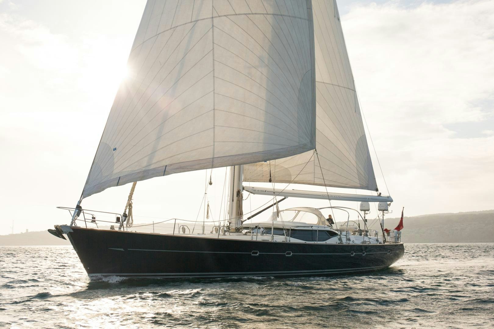 a black and white sailboat on the water aboard MATHILDA SOUND Yacht for Sale