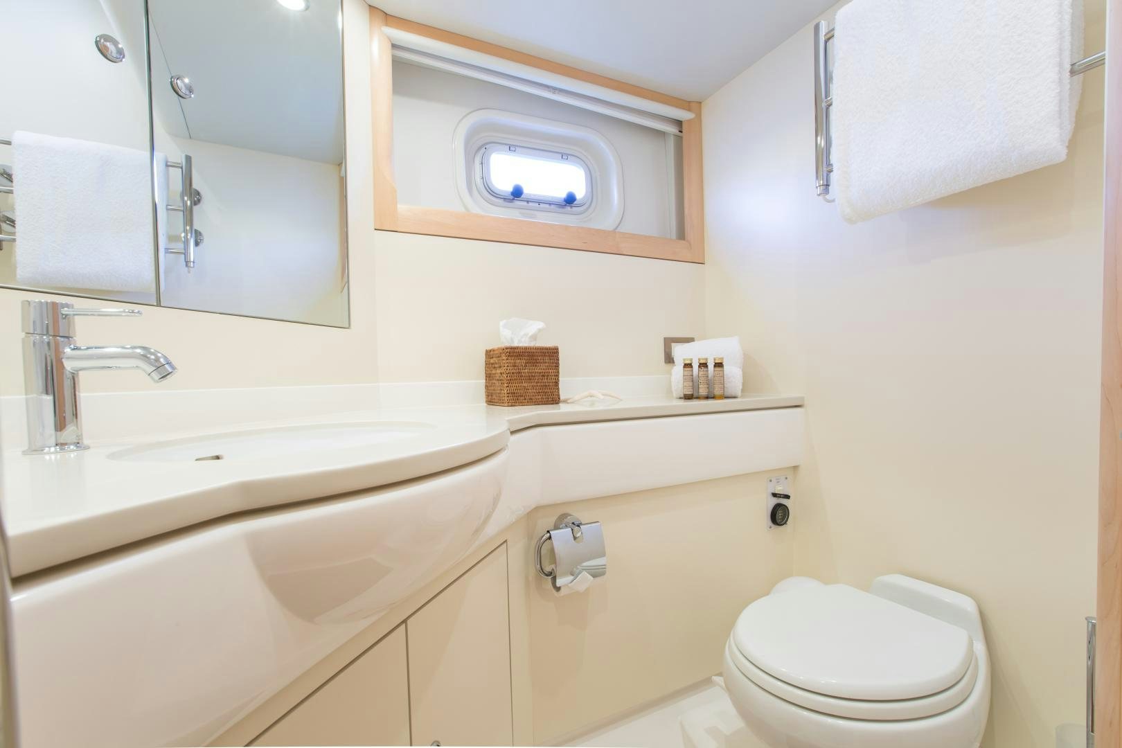 a bathroom with a toilet and a sink aboard MATHILDA SOUND Yacht for Sale