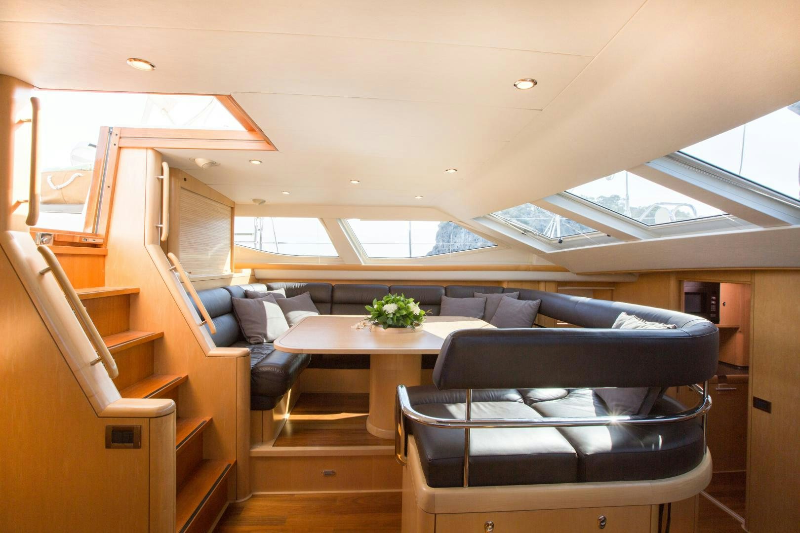a room with a couch and a table aboard MATHILDA SOUND Yacht for Sale