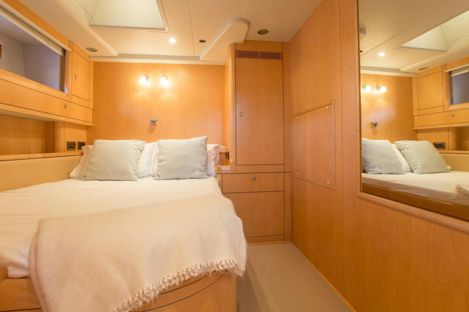 a room with a bed and a closet aboard MATHILDA SOUND Yacht for Sale