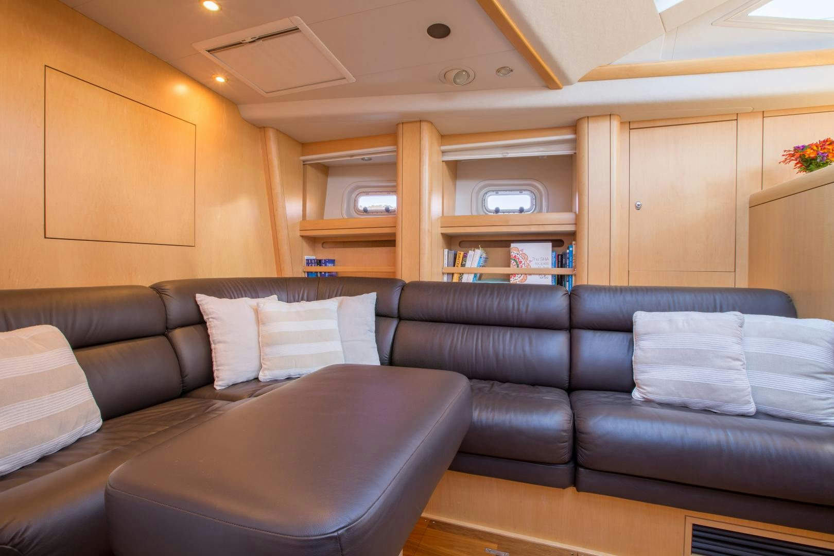 a living room with leather couches aboard MATHILDA SOUND Yacht for Sale