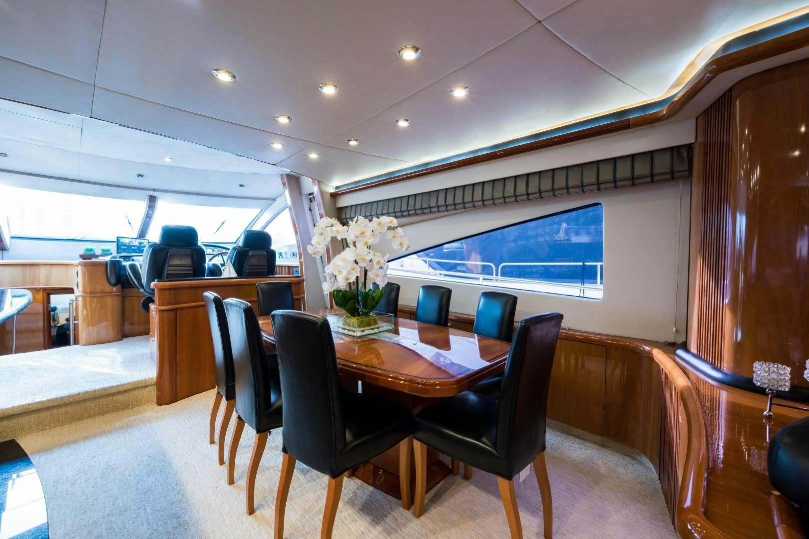 a room with tables and chairs aboard SS ARTS Yacht for Sale