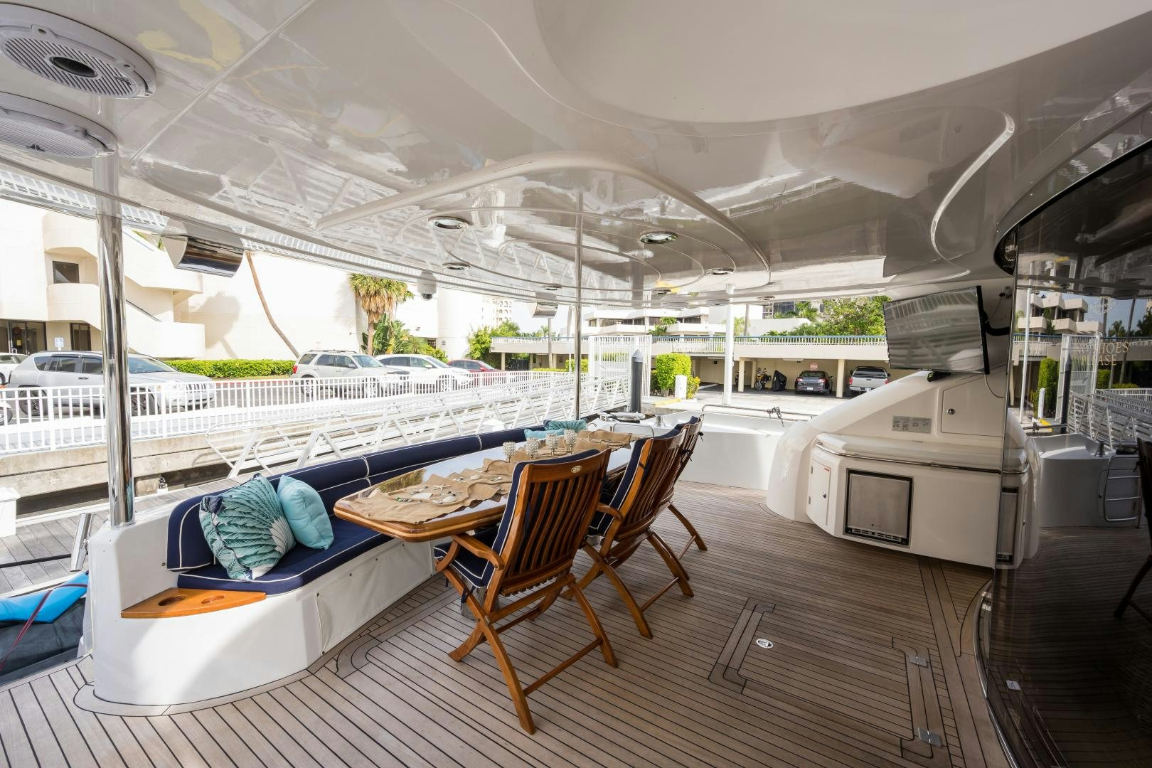 a table and chairs on a deck aboard SS ARTS Yacht for Sale