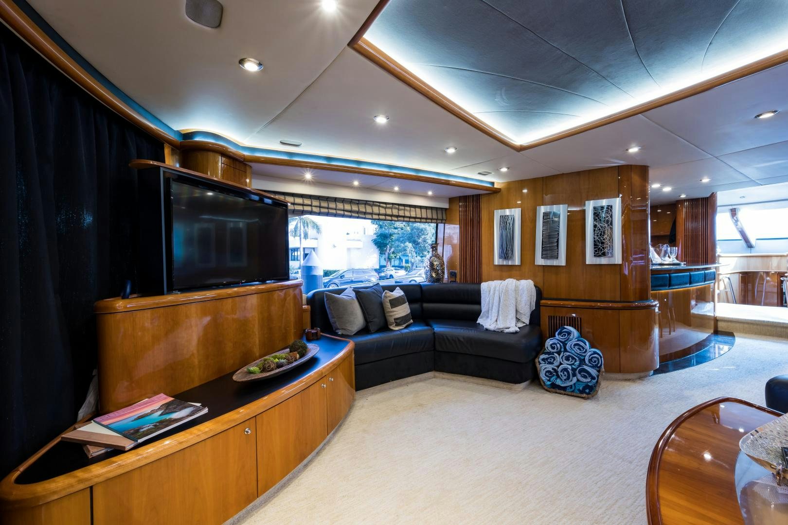 a living room with a large mirror aboard SS ARTS Yacht for Sale