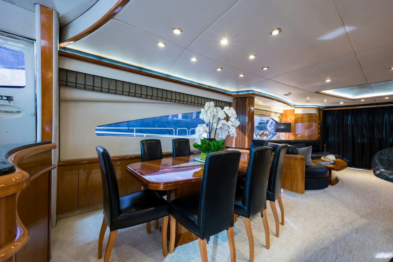 a room with a table and chairs aboard SS ARTS Yacht for Sale