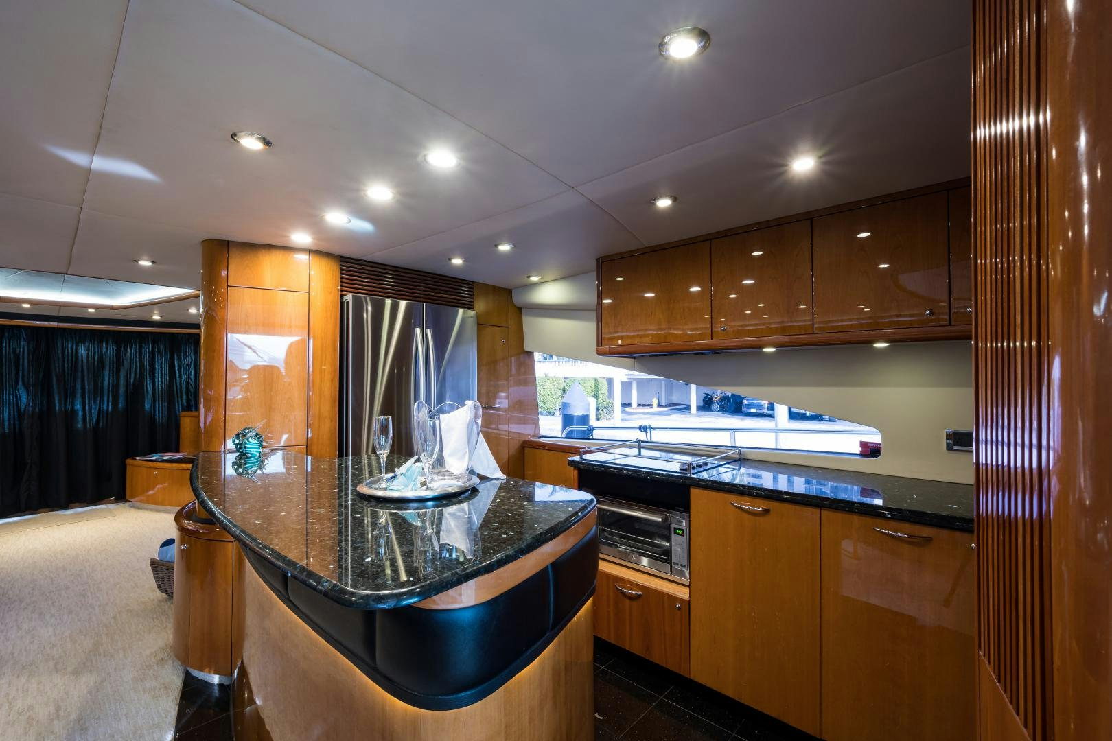 a kitchen with wooden cabinets aboard SS ARTS Yacht for Sale