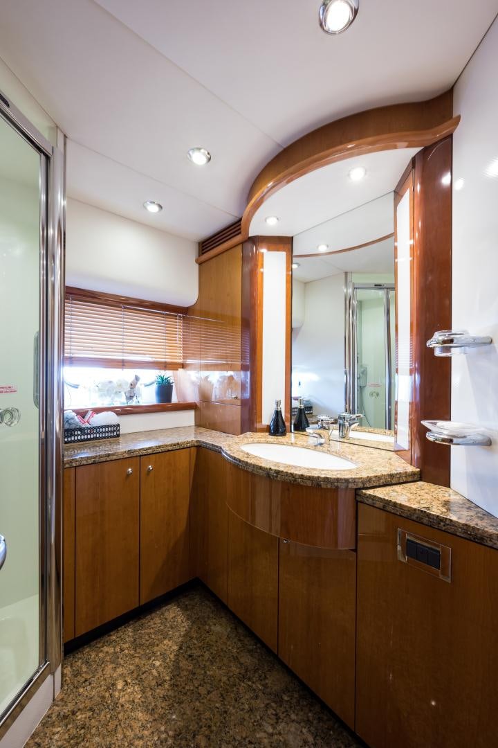 a bathroom with a large mirror aboard SS ARTS Yacht for Sale