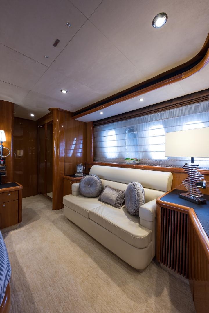 a room with a bed and a window aboard SS ARTS Yacht for Sale