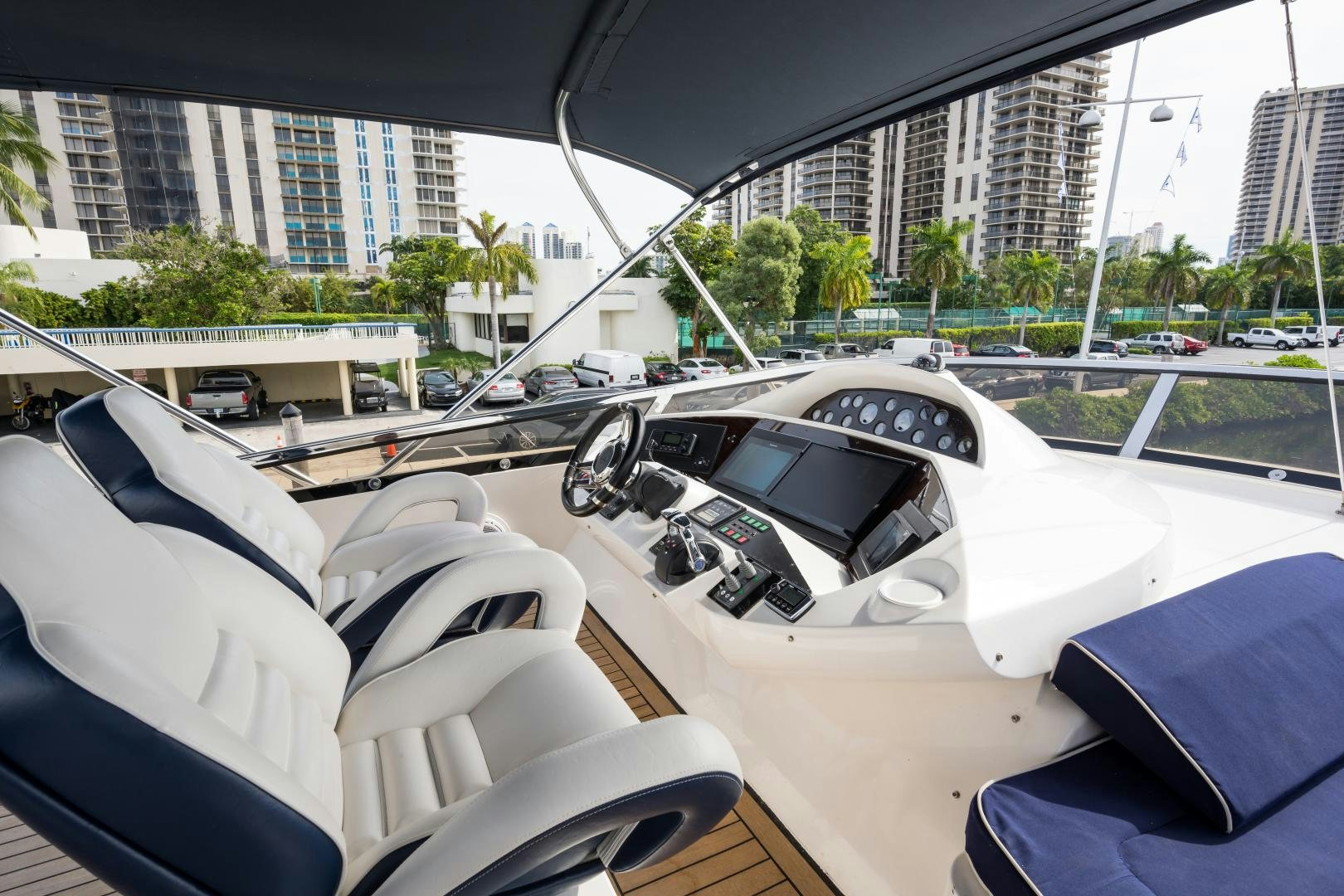 a group of cars parked in a parking lot aboard SS ARTS Yacht for Sale