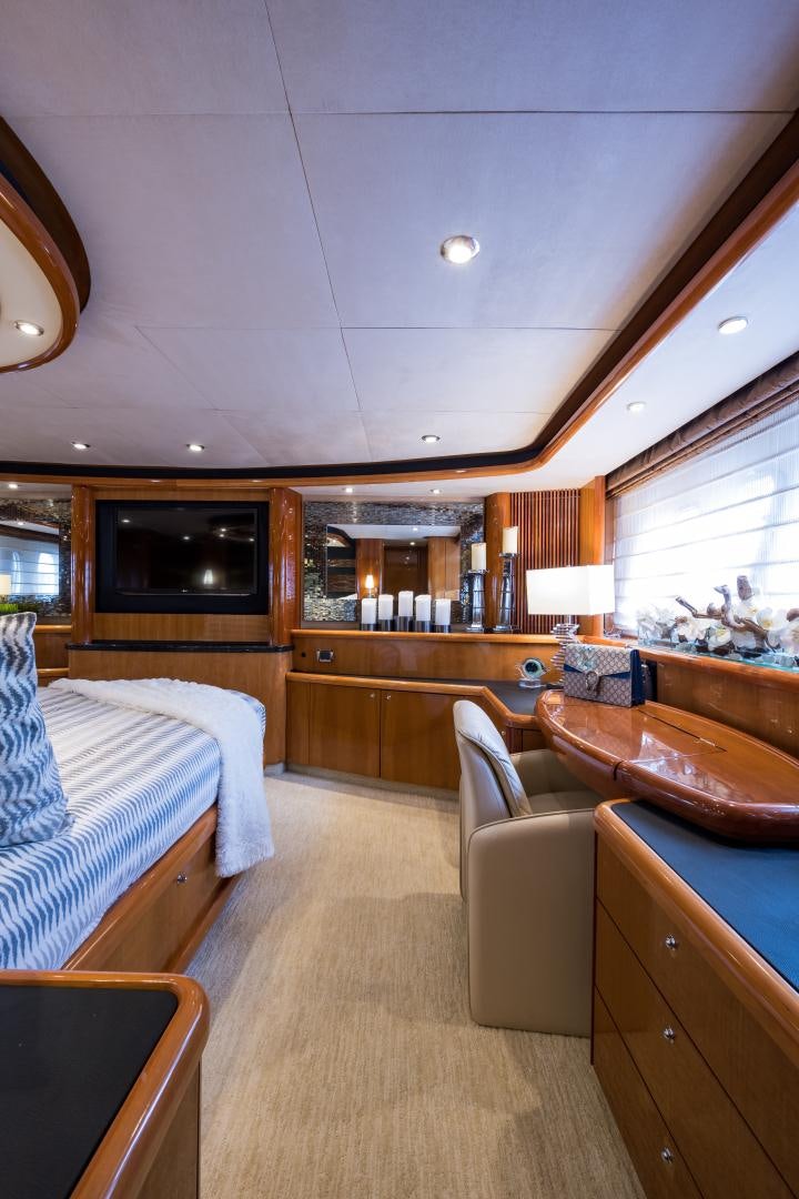 a room with a bed and a couch aboard SS ARTS Yacht for Sale