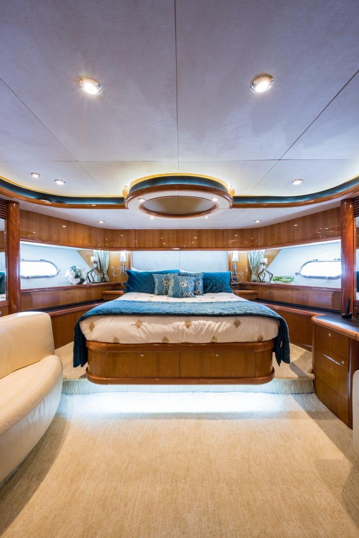 a large bedroom with a large bed aboard SS ARTS Yacht for Sale
