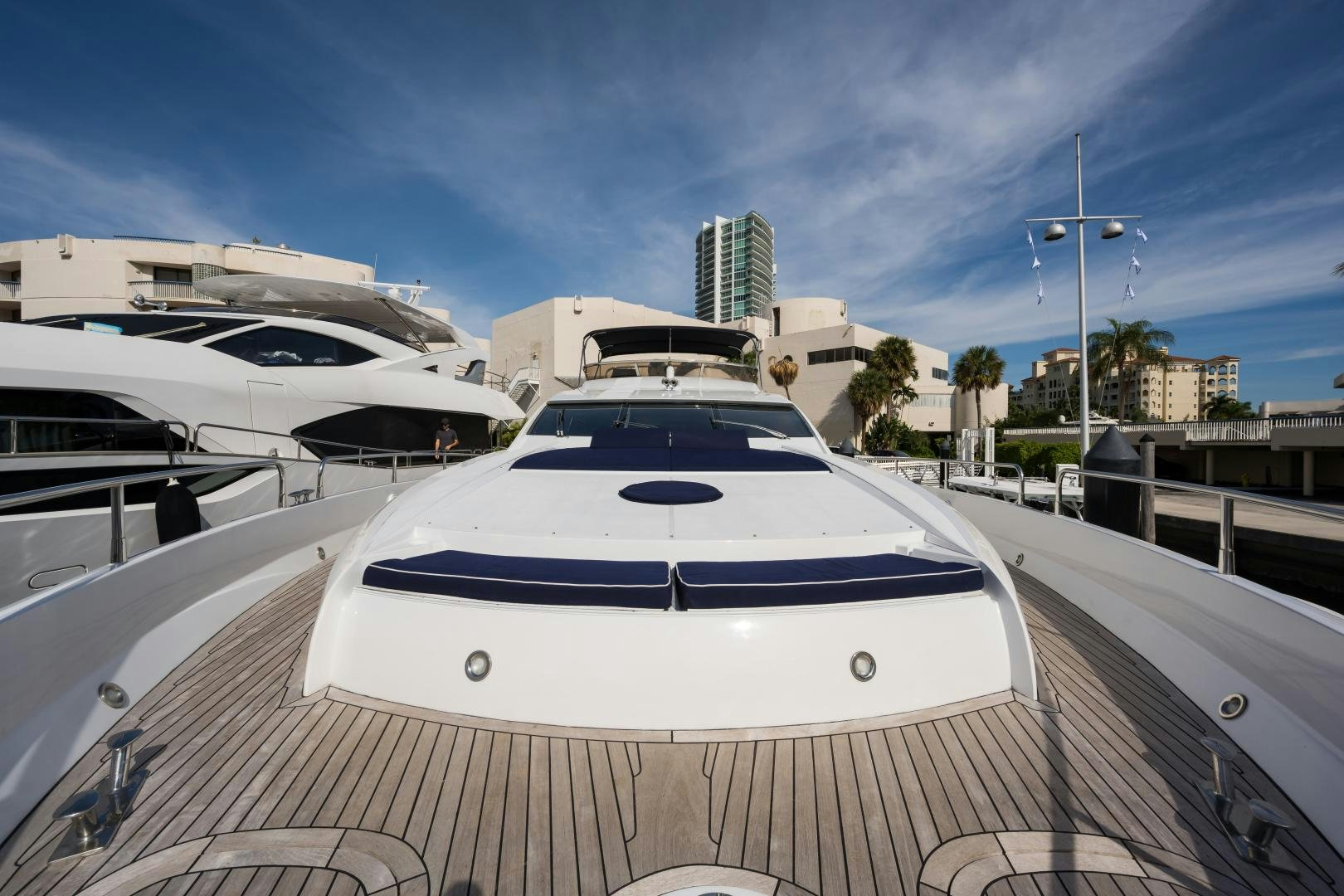 a white yacht in a dock aboard SS ARTS Yacht for Sale