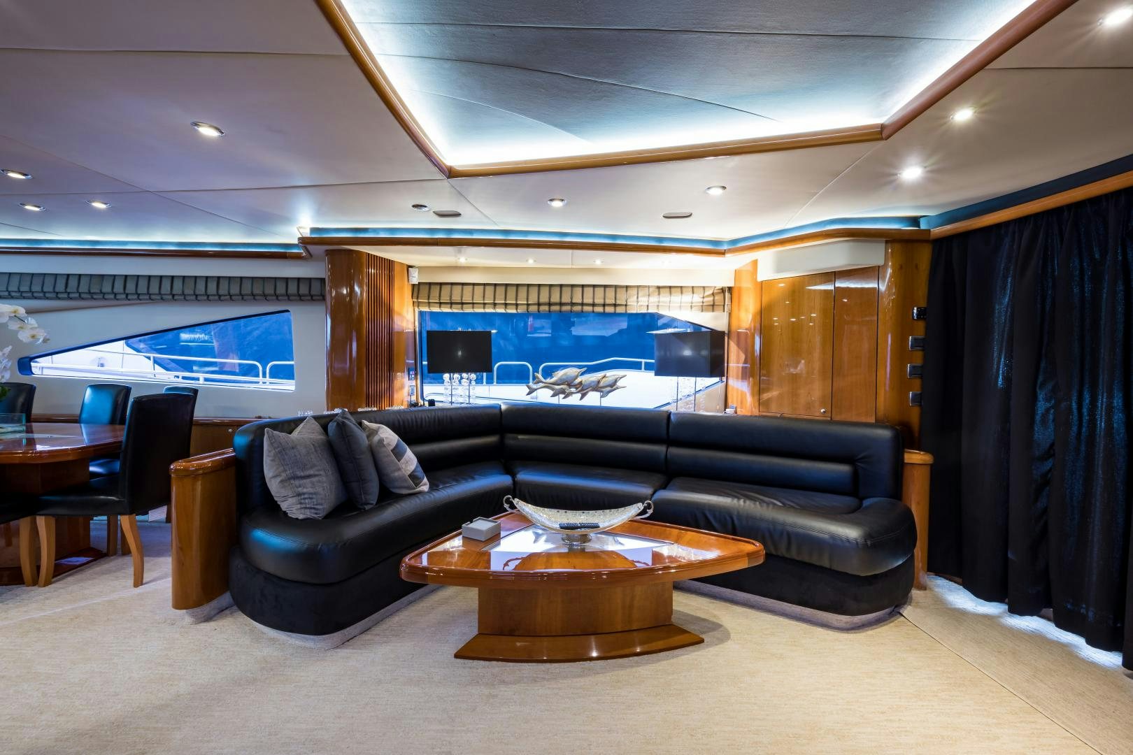 a living room with a leather couch aboard SS ARTS Yacht for Sale
