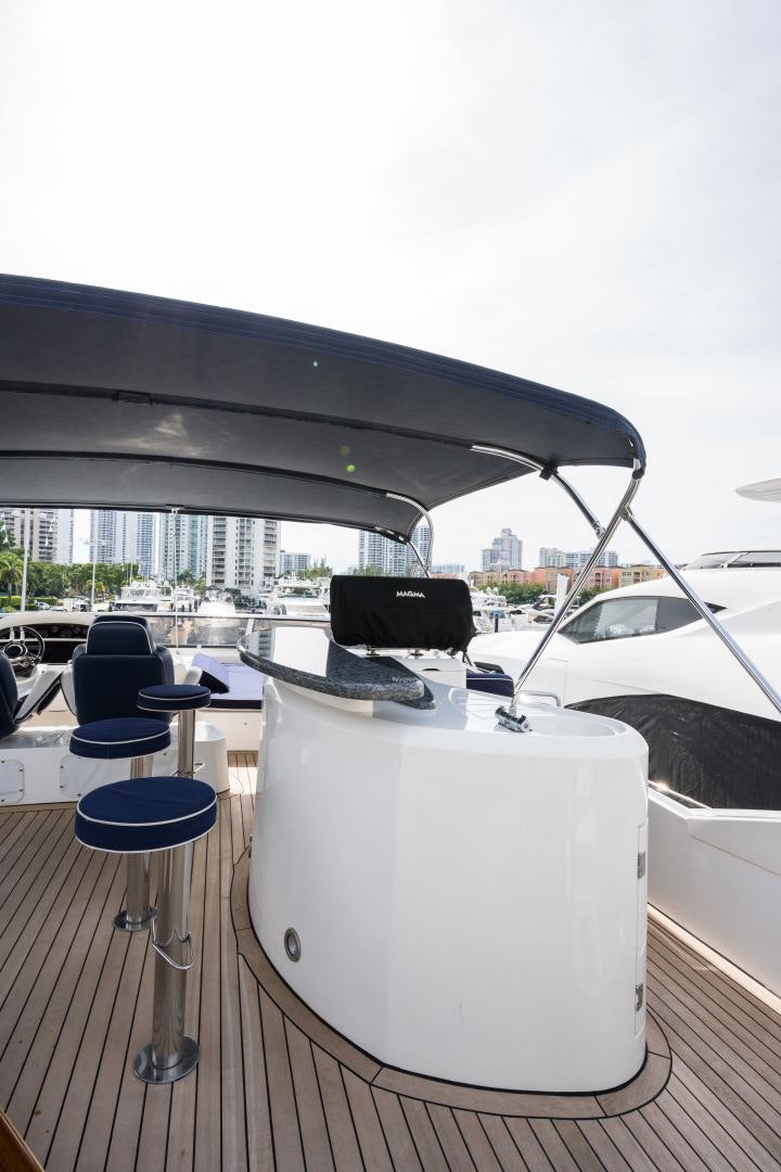 a white table with a black laptop on it aboard SS ARTS Yacht for Sale