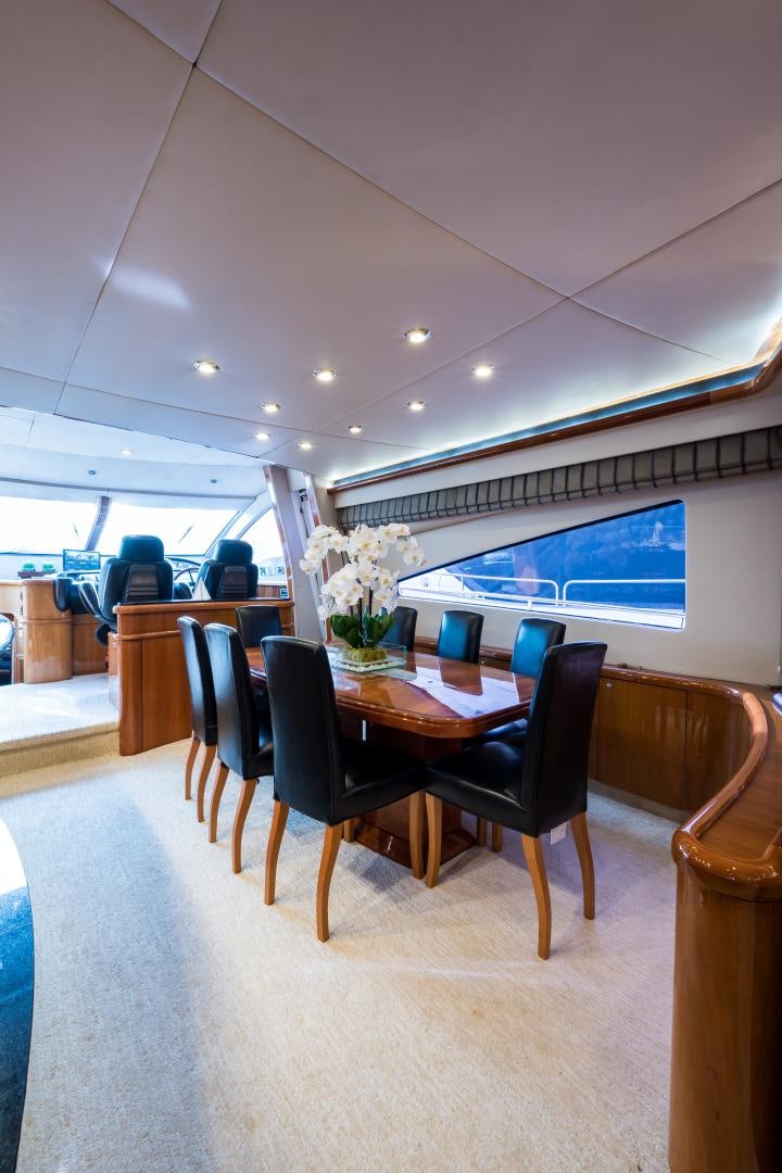 a room with a table and chairs aboard SS ARTS Yacht for Sale