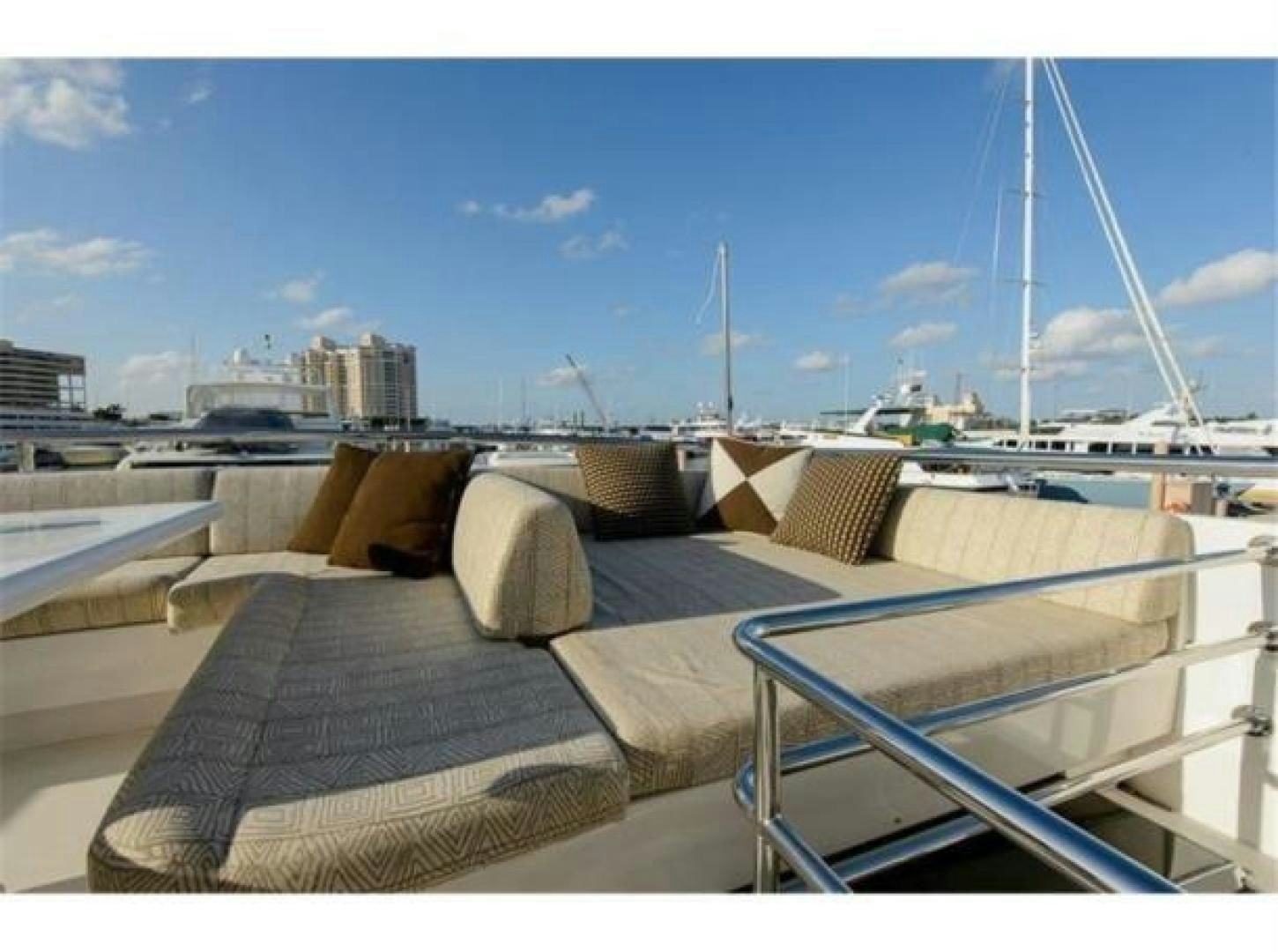 a deck with lounge chairs on it aboard PRIMETIME Yacht for Sale