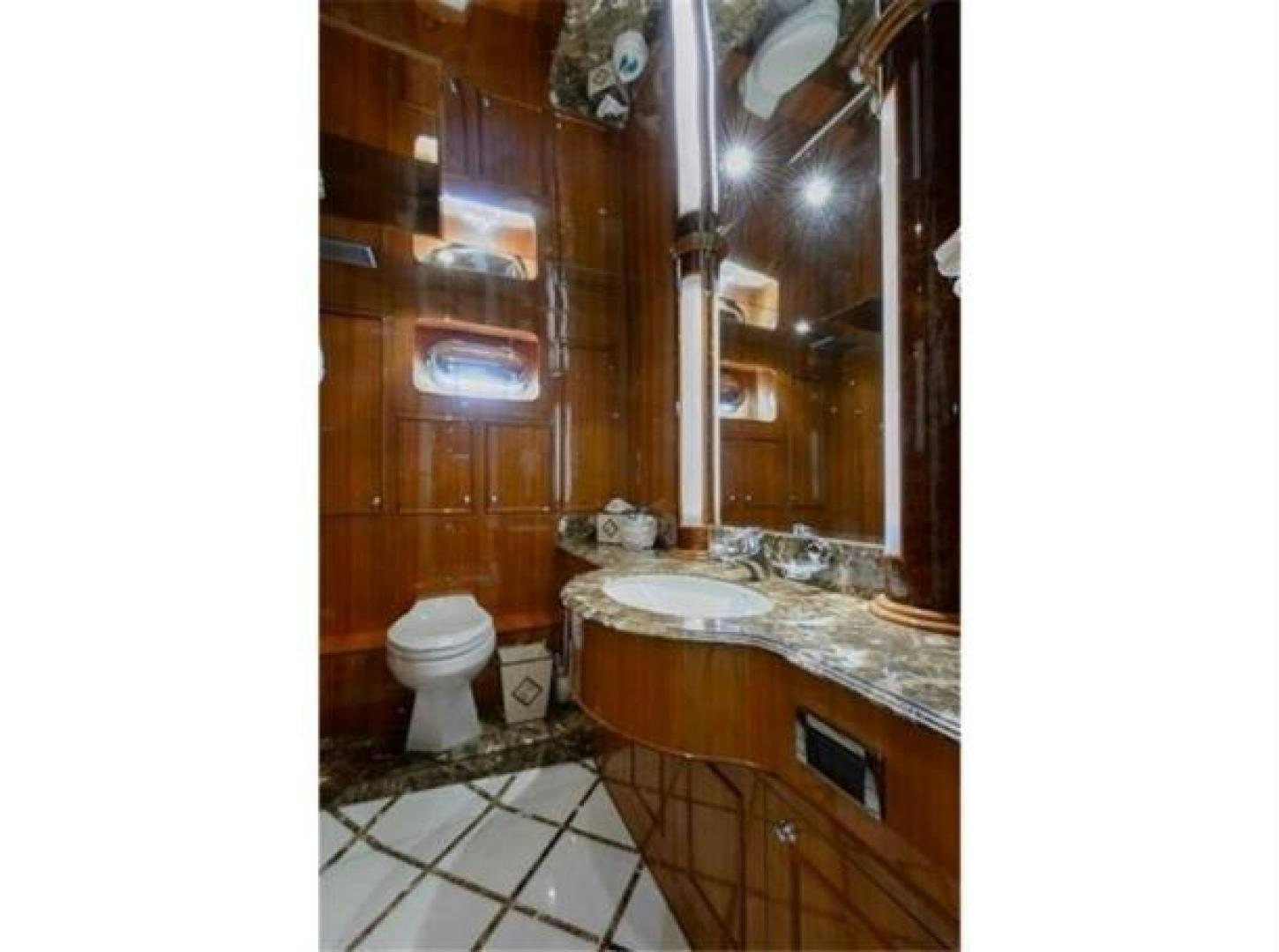 a bathroom with a sink and toilet aboard PRIMETIME Yacht for Sale