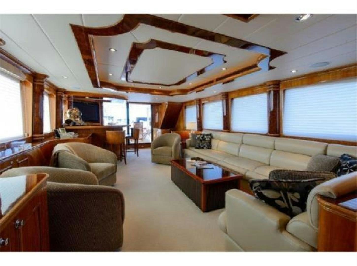 a living room with a large ceiling aboard PRIMETIME Yacht for Sale