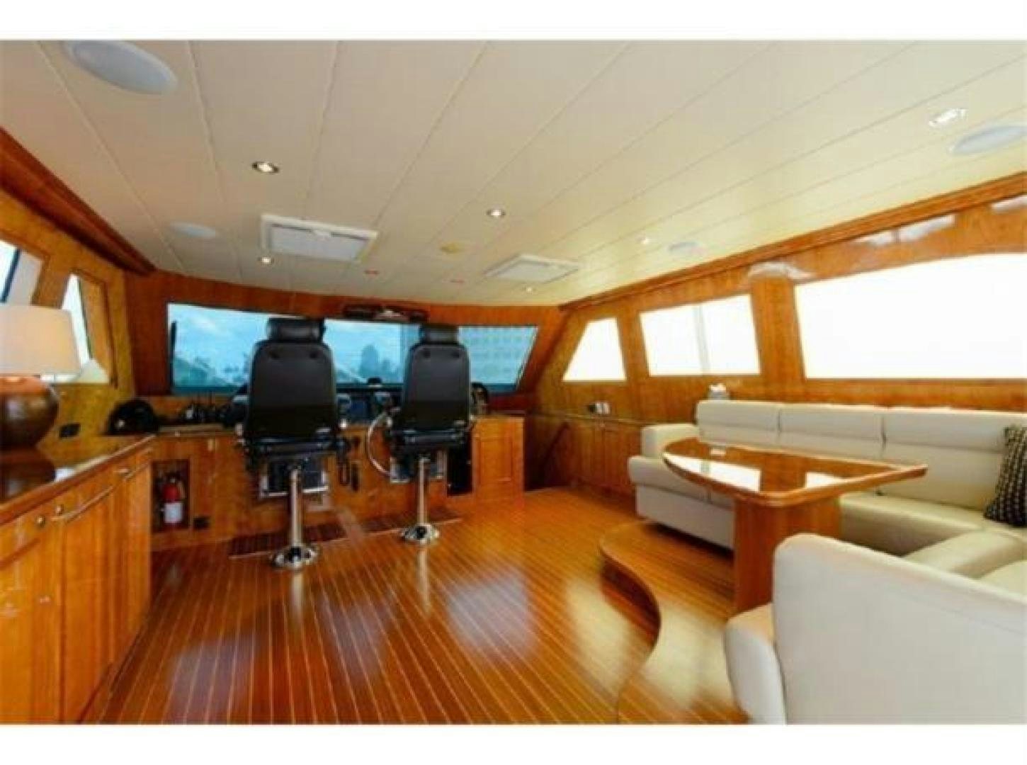a living room with a wood floor aboard PRIMETIME Yacht for Sale