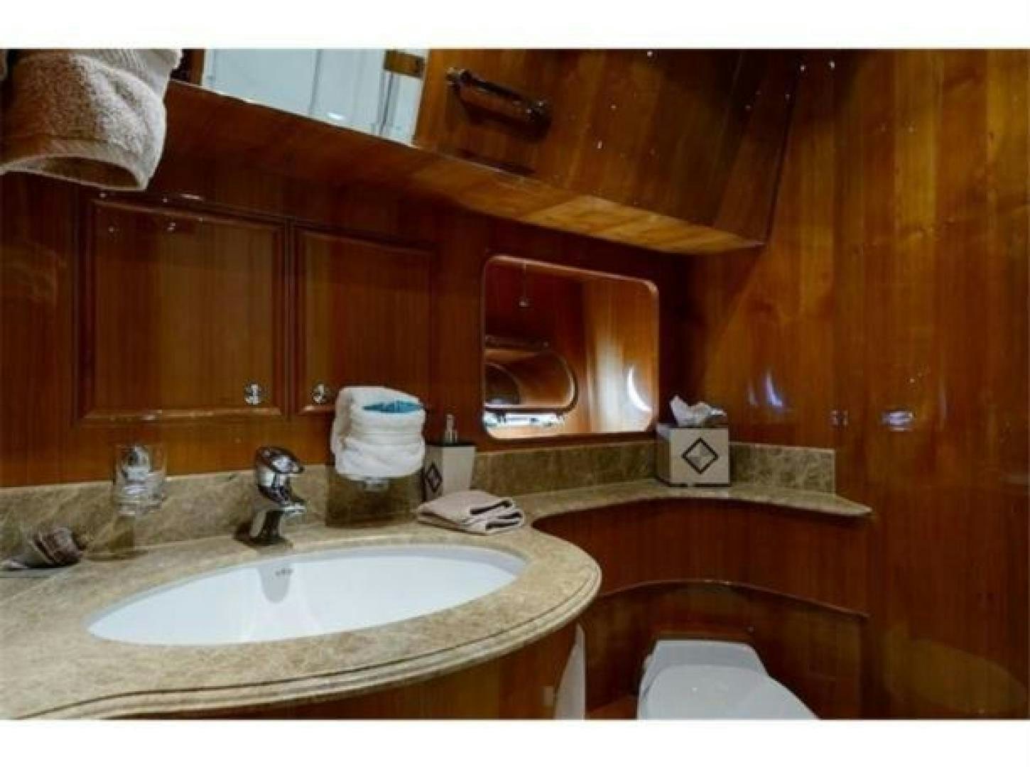 a bathroom with a sink and toilet aboard PRIMETIME Yacht for Sale