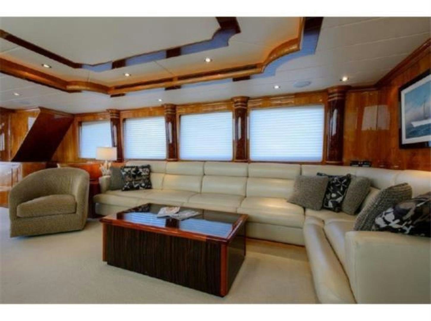 a living room with a couch and a coffee table aboard PRIMETIME Yacht for Sale